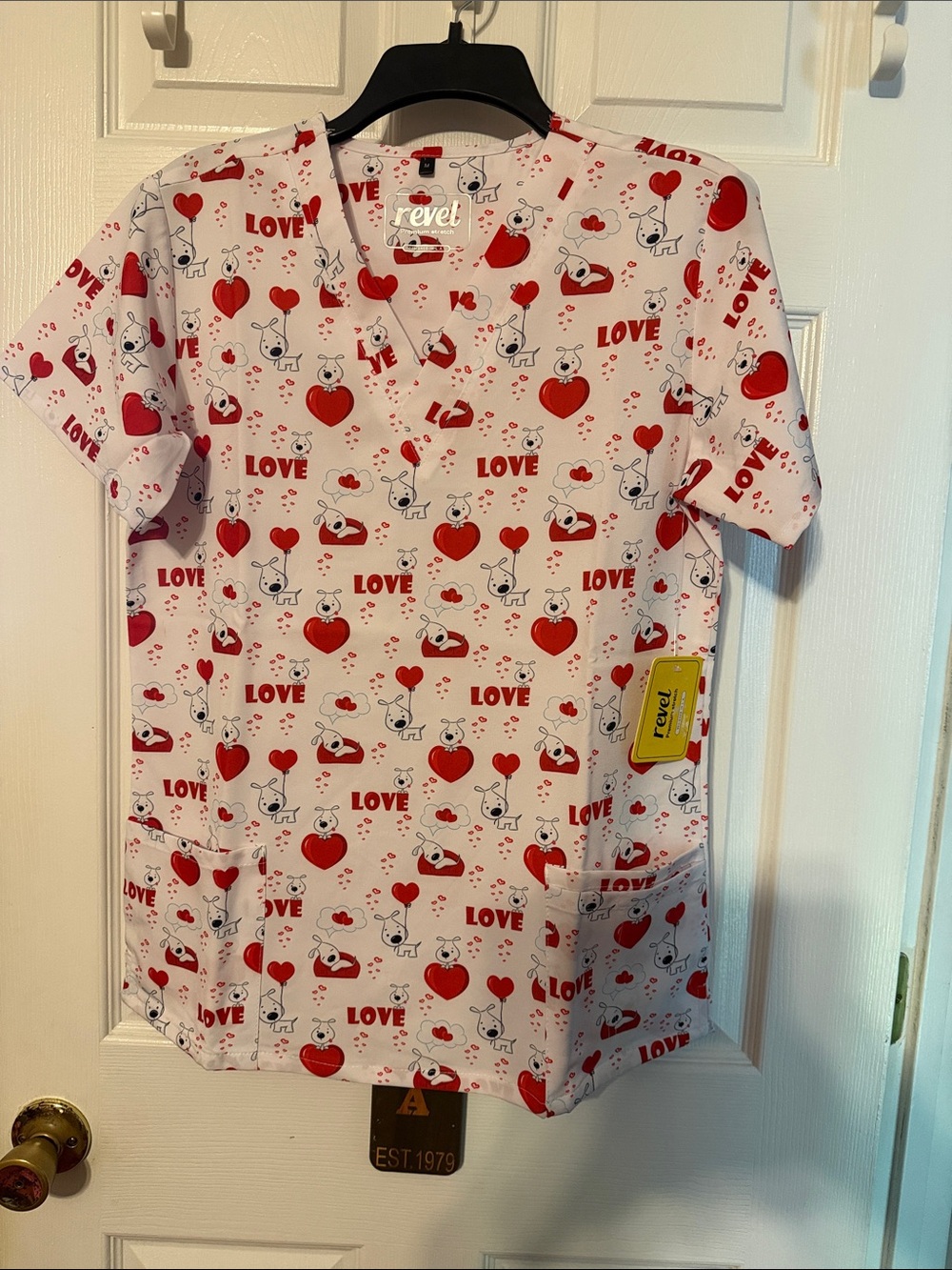 Revel women’s Bobby Furry Valentine Print Scrub with multiple pockets; size: M